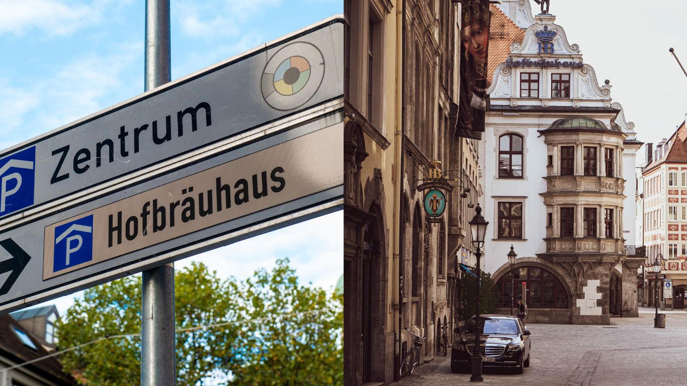 Et vejskilt, der viser vej til "Zentrum" og "Hofbräuhaus" til venstre. Til højre en gade i München med det historiske Hofbräuhaus-bryggeri i baggrunden.